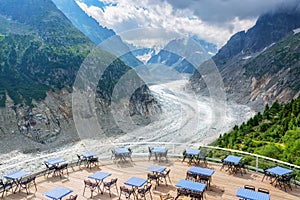 Panoramic cafe terrace with view on glacier Mer de Glace, in Chamonix Mont Blanc Massif, The Alps France