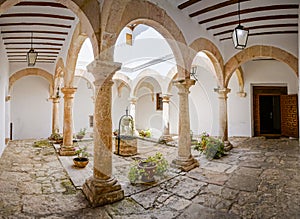 Panoramic of Castilian patio with well in the center