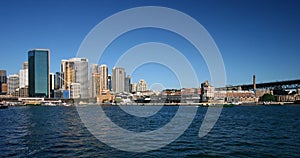 Panoramic Circular Quay cityscape and the historic Rocks in Sydney harbor. Iconic skyline of downtown and heritage buildings.