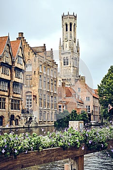 Panoramic city view with Belfry tower and famous canal in Bruges, Belgium