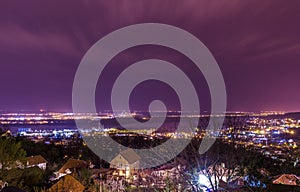 Panoramic cityscape view on Danube river in Belgrade with beautiful magenta sky and moving clouds