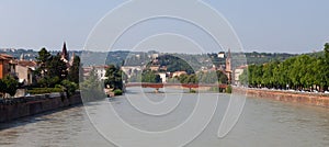 A panoramic cityscape view of Verona old town and the bridge over the Adige river