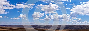 Panoramic clouds over hills