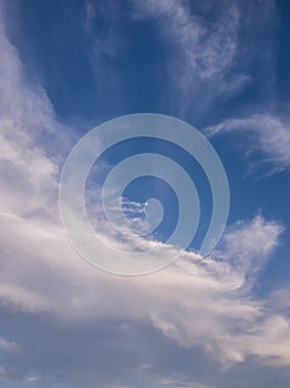Panoramic cloudscape scene over the blue sky. Fluffy white clouds aerial composition. Misty overcast cumulus shapes, abstract