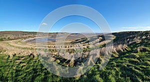 Panoramic coastline view of Teletubby Hill at Burry Port Carmarthenshire South Wales
