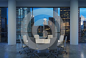 Panoramic conference room in modern office, cityscape of New York skyscrapers at night, Manhattan.