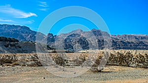 panoramic desert sand stone landcape Middle East view of dry contry side environment with mountains backround and bridge landmark