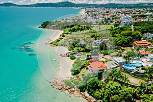 Panoramic drone view. Tropical holiday beach with turquoise ocean in Brazil, Florianopolis photo