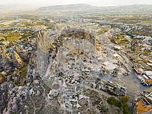 Panoramic drone view of the volcanic tufa rock formations, cave houses carved in stone, Cappadocia, the Central Anatolia