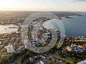 Panoramic evening aerial drone shot of Manly, a beach-side suburb of northern Sydney, in the state of New South Wales