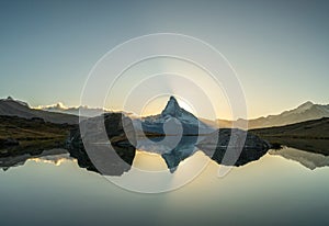 Panoramic evening view of Lake Stellisee with the Matterhorn Cervino Peak in the background. Impressive autumn scene of