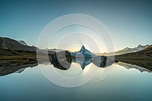 Panoramic evening view of Lake Stellisee with the Matterhorn Cervino Peak in the background. Impressive autumn scene of