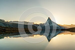 Panoramic evening view of Lake Stellisee with the Matterhorn Cervino Peak in the background. Impressive autumn scene of