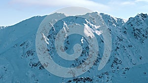 Panoramic footage of snow-covered mountain - The peak of mountains touching the sky