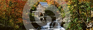 Panoramic of Glade Creek Grist Mil and autumn reflections and waterfall in Babcock State Park, WV photo