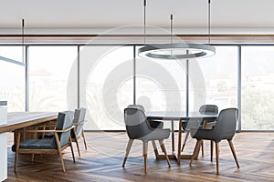 Panoramic grey and white dining room with on trend lights over tables