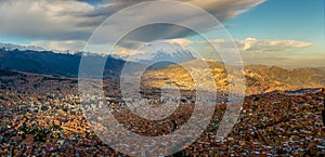 Panoramic HDR photo of the city of La Paz, Bolivia, during sunset with Illimani Mountain rising in the background photo