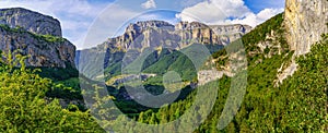 Panoramic high rocky mountain landscape with green forests. Ordesa Pirineos National Park. Spain photo
