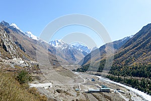 Panoramic Himalayas Highland Islands Mountain valley, panorama of city Sangla Valley, Chitkul village, from the hiking trail in