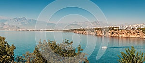 idyllic view of the sea coast in Antalya. Taurus mountains in the background and the blue Bay of the Mediterranean sea