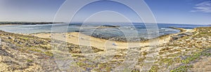 Panoramic image on the beach of the Portuguese coastal town Bairro Monte Vistoso photo