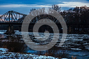 Panoramic image of a beautiful winter landscape. old bridge