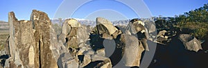 Panoramic image of petroglyphs at Three Rivers Petroglyph National Site, a (BLM) Bureau of Land Management Site, features more photo