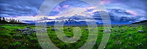 Panoramic image of a thunderstorm over the Grand Teton mountain range