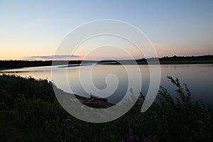 Peaceful river landscape at sunset.