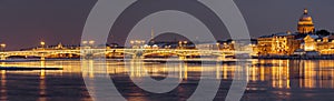 The panoramic image of the winter night city Saint-Petersburg, Blagoveshchensky Bridge, the bridge of the lieutenant