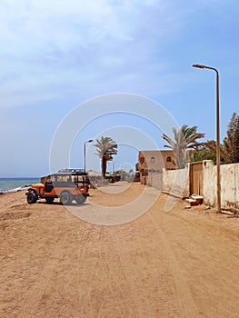 Panoramic jeep on desert sandstone street of Sinai Peninsula. Red Sea coast and adventure routes through the Dahab desert