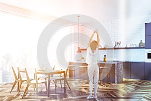 Panoramic kitchen with bar and table, woman