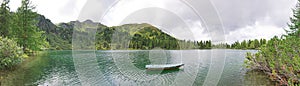 Panoramic lake view with boat