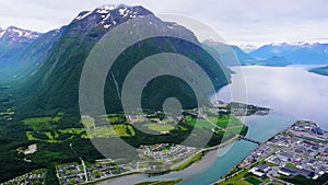 Panoramic landscape Andalsnes city located on shores of Romsdalsfjord Romsdal Fjord between the picturesque mountains. Norway.