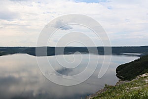 The panoramic landscape of Bakota Bay view. Dniester river, Ukraine. The banks of a large river with calm smooth water.