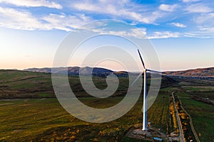 Panoramic landscape from the country road to the wind turbine, the development of wind energy in Ukraine