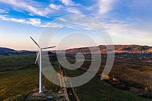 Panoramic landscape from the country road to the wind turbine, the development of wind energy in Ukraine