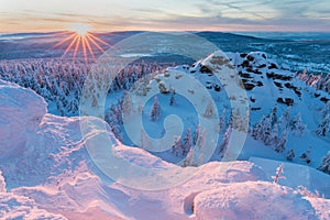 Panoramic landscape of Jizera Mountains, view from peak Izera with frosty spruce forest, trees and hills. Winter time