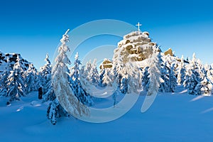 Panoramic landscape of Jizera Mountains, view from peak Izera with frosty spruce forest, trees and hills. Winter time