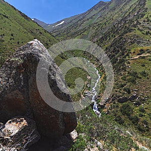 Panoramic landscape with mountain river with cascades of waterfalls in field in Kaskasu gorge in summer in Kazakhstan