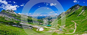 Panoramic landscape of mountains of Alps in summer with a lake in Portes du Soleil, France