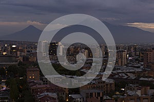 Panoramic landscape night scene of Yerevan capital of Armenia city with lights and mount Ararat