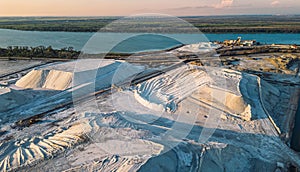 Panoramic landscape of pink salt pans and salt piles at Salin de Giraud in Camargue