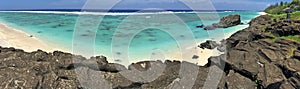 Panoramic landscape view of Black Rock Beach in Rarotonga Cook I