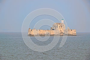 Panoramic landscape view of Fortim-do-Mar also known as Panikota Fort or Pani Kotha or Diu Jail located in Arabian Sea opposite