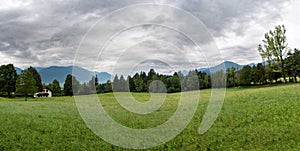 Panoramic landscape view of meadow in Austria.