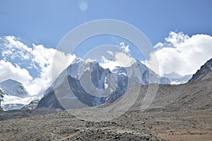 Panoramic landscape view of snowcapped great Himalayas mountains seen from Gurudongmar Lake, a famous tourist attraction in Mangan