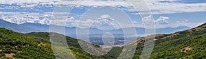 Panoramic Landscape view from Travers Mountain of Provo, Utah County, Utah Lake and Wasatch Front Rocky Mountains, and Cloudscape.