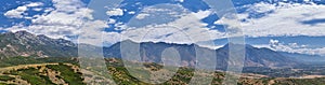 Panoramic Landscape view from Travers Mountain of Provo, Utah County, Utah Lake and Wasatch Front Rocky Mountains, and Cloudscape.