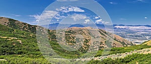 Panoramic Landscape view of Wasatch Front Rocky and Oquirrh Mountains, Rio Tinto Bingham Copper Mine, Great Salt Lake Valley in su photo